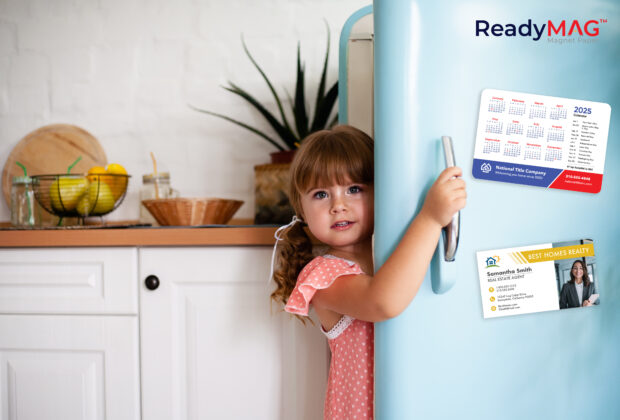 Girl opening refrigerator door with ReadyMAG magnets on the door.